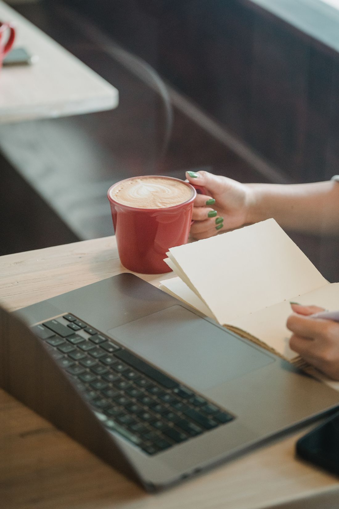 A professional planning her work at a cafe