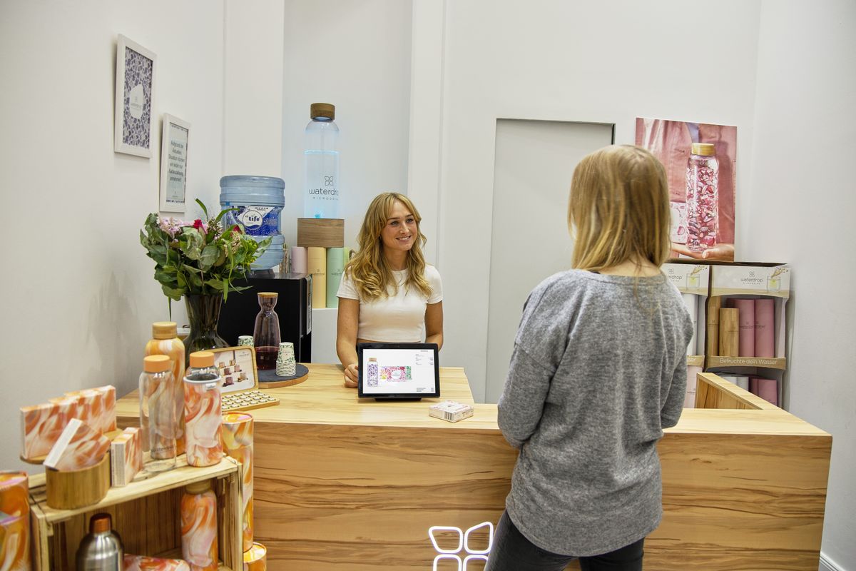 A salon professional listening to a customer